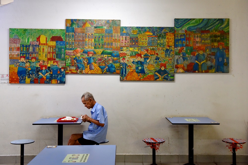 A man dines alone in a food centre, amidst dining regulations imposed by the government which only allow up to two people to dine together, amidst the coronavirus disease pandemic, in Singapore November 3, 2021. u00e2u20acu201d Reuters pic