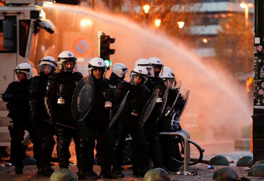 Police forces stand guard as people protest against Covid-19 measures near the European Commission in Brussels November 21, 2021. u00e2u20acu201d Reuters pic