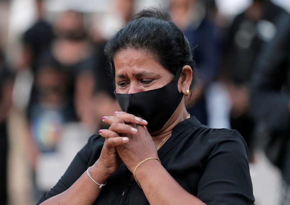 A family member of a victim of the 2019 Easter Sunday bomb attacks reacts near a mass graveyard next to St. Sebastianu00e2u20acu2122s Church, one of the churches that was attacked, during the second anniversary in Katuwapitiya, Sri Lanka April 21, 2021. u00e2u20acu201d Reuters p