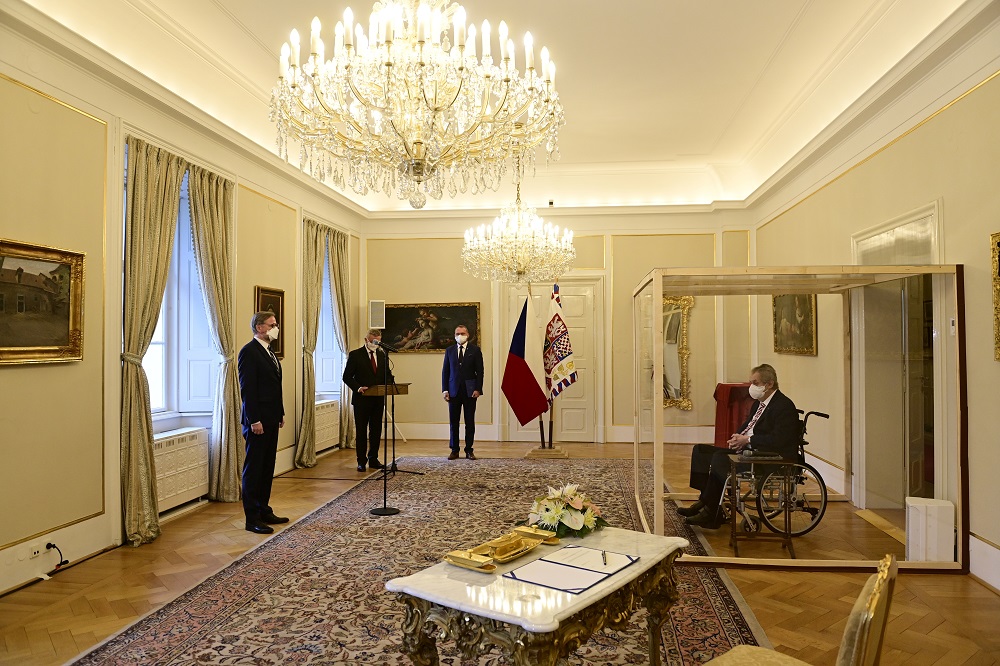 Czech President Milos Zeman, separated by a transparent wall after testing positive for the coronavirus disease, appoints Civic Democratic Party leader Petr Fiala as the new prime minister, at the Lany Chateau, near Prague November 28, 2021. u00e2u20acu201d Roman Von