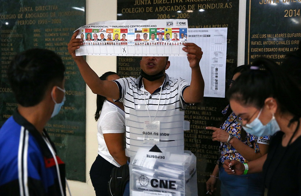 An election volunteer displays the ballot as vote counting begins during the general election, at a school in Catacamas, Honduras November 28, 2021. u00e2u20acu201d Reuters pic