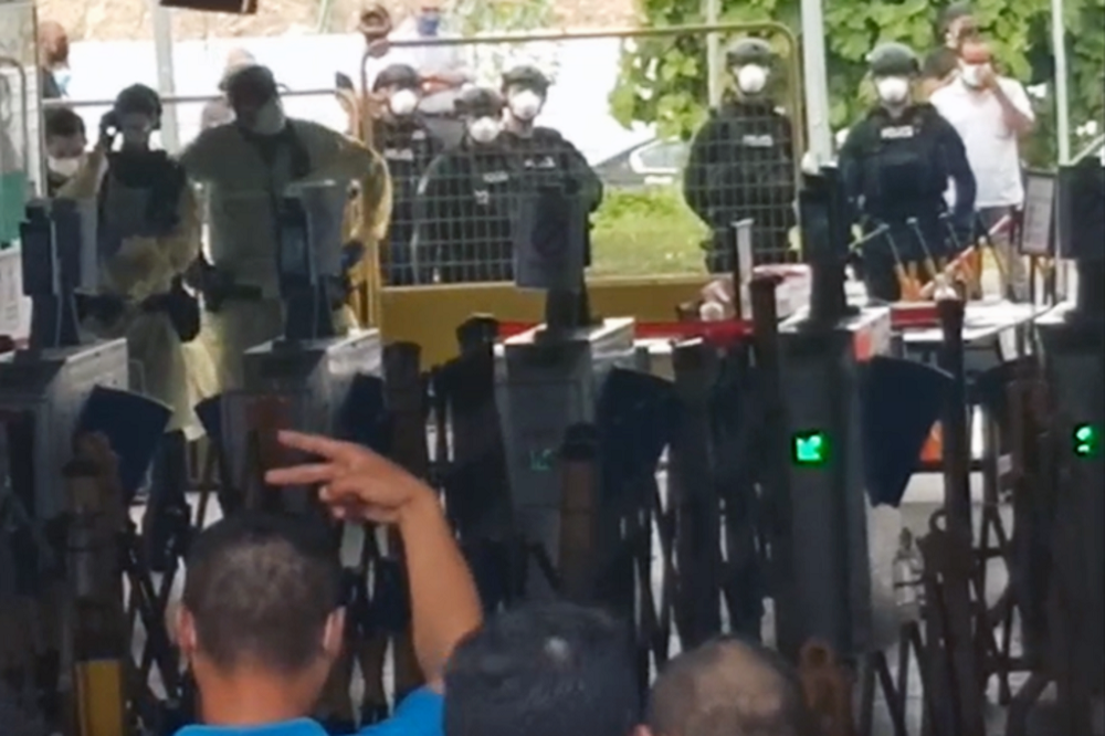 A scene from the incident at Westlite Jalan Tukang dormitory. u00e2u20acu201d Screen capture via Whatsapp/TODAY