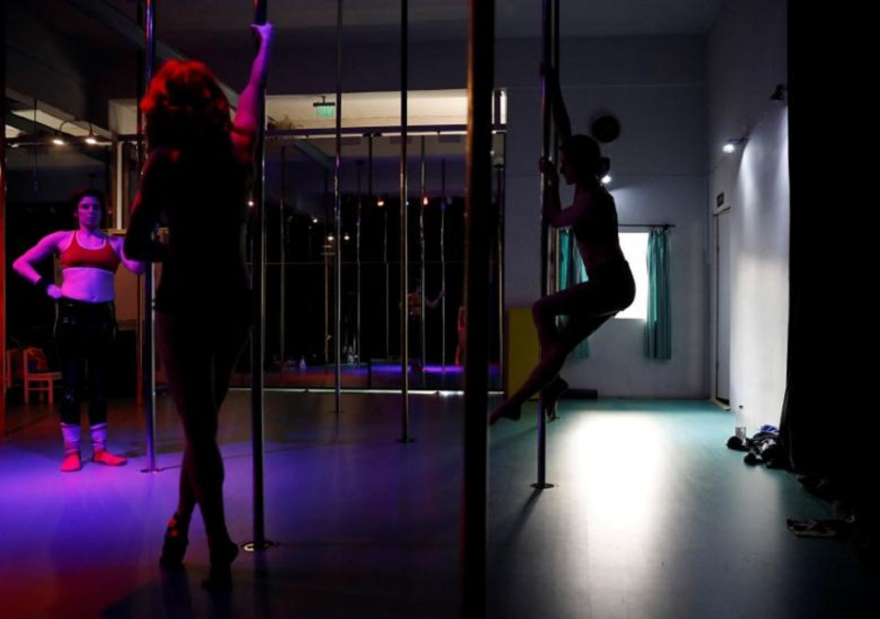 The organisers of an industrial conference in East China set tongues wagging when it included pole dancing as part of its entertainment programme. u00e2u20acu201d Reuters pic