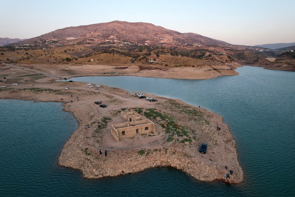 An aerial view shows the remains of the submerged Gary Qasruka village abandoned 36 years ago, which have resurfaced following a large drop in water level of the Dohuk Dam due to drought, November 4, 2021. u00e2u20acu201d AFP pic 