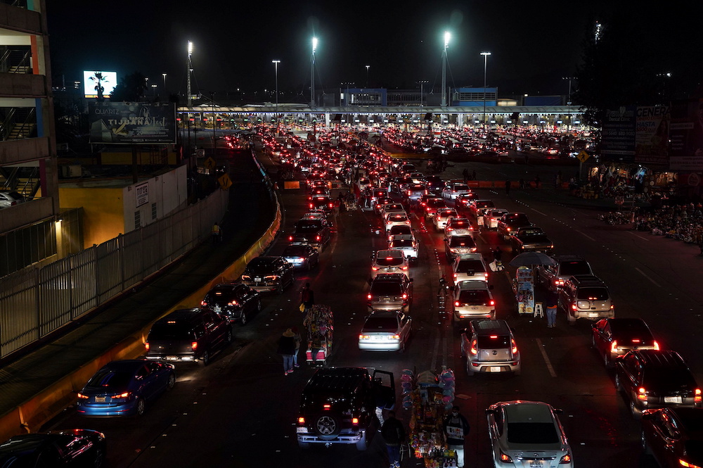 Cars wait in line to cross into the US, ahead of the Mexico-US border reopening in Tijuana, Mexico November 7, 2021. u00e2u20acu201d Reuters pic
