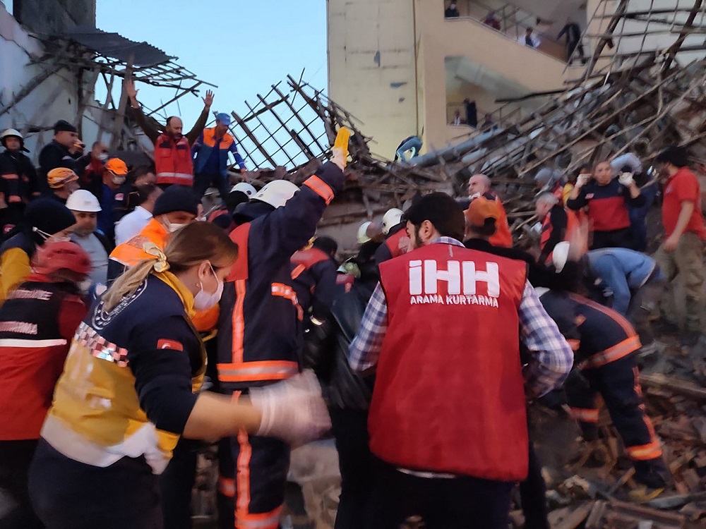This handout picture released by Turkeyu00e2u20acu2122s IHH humanitarian aid group on November 9, 2021, shows members of rescue services as they work at the site of a collapsed building in the town of Battalgazi, in Malatya province. u00e2u20acu201d AFP pic