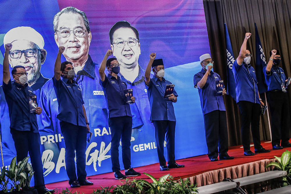 Perikatan Nasional chairman Tan Sri Muhyiddin Yassin (centre) together with Perikatan Nasional supreme council during launch of Melaka State Election (PRN) manifesto book at the Glenmarie Hotel and Resort November 14, 2021. u00e2u20acu2022 Picture by Hari Anggara