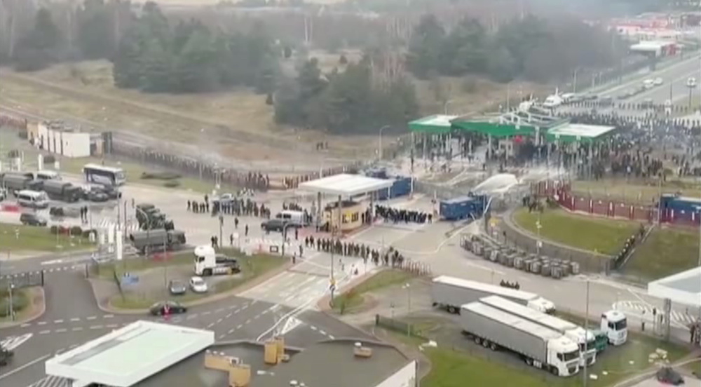 A handout image from Polish law enforcement officers standing guard at Kuznica - Bruzgi checkpoint, as hundreds of migrants gather on the Belarusian side of the border with Poland in an attempt to cross it, Poland, November 16, 2021. u00e2u20acu201d Reuters pic