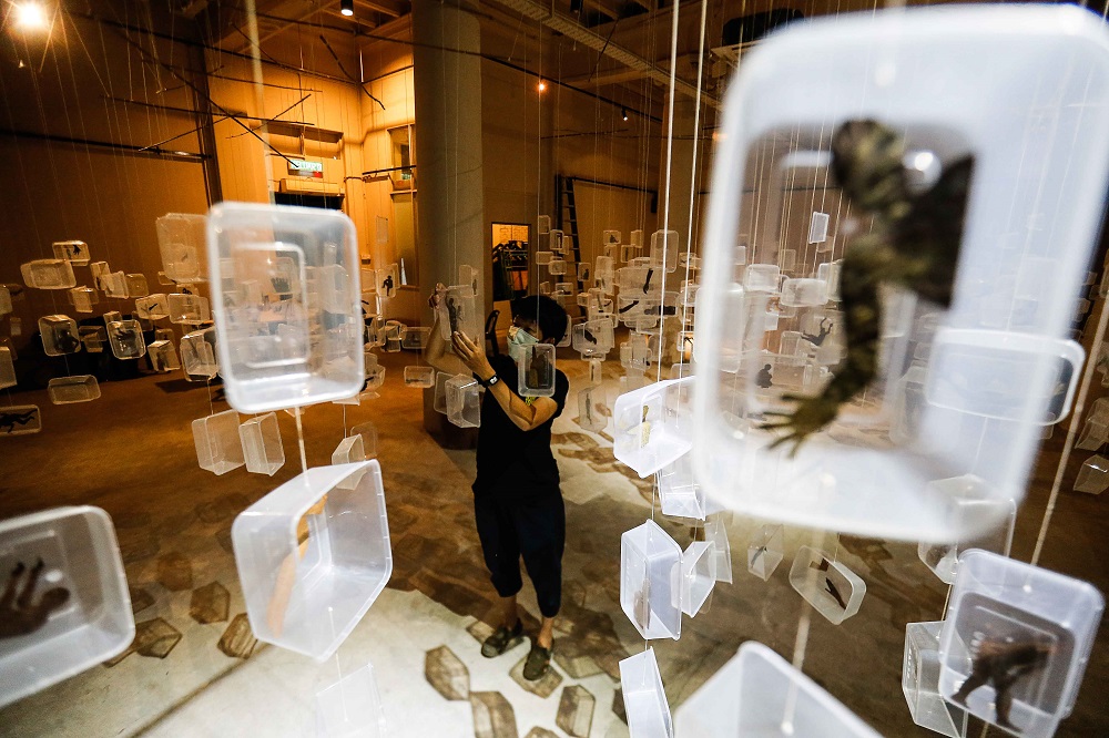 A close-up look at some of the plastic boxes in the art installation. 