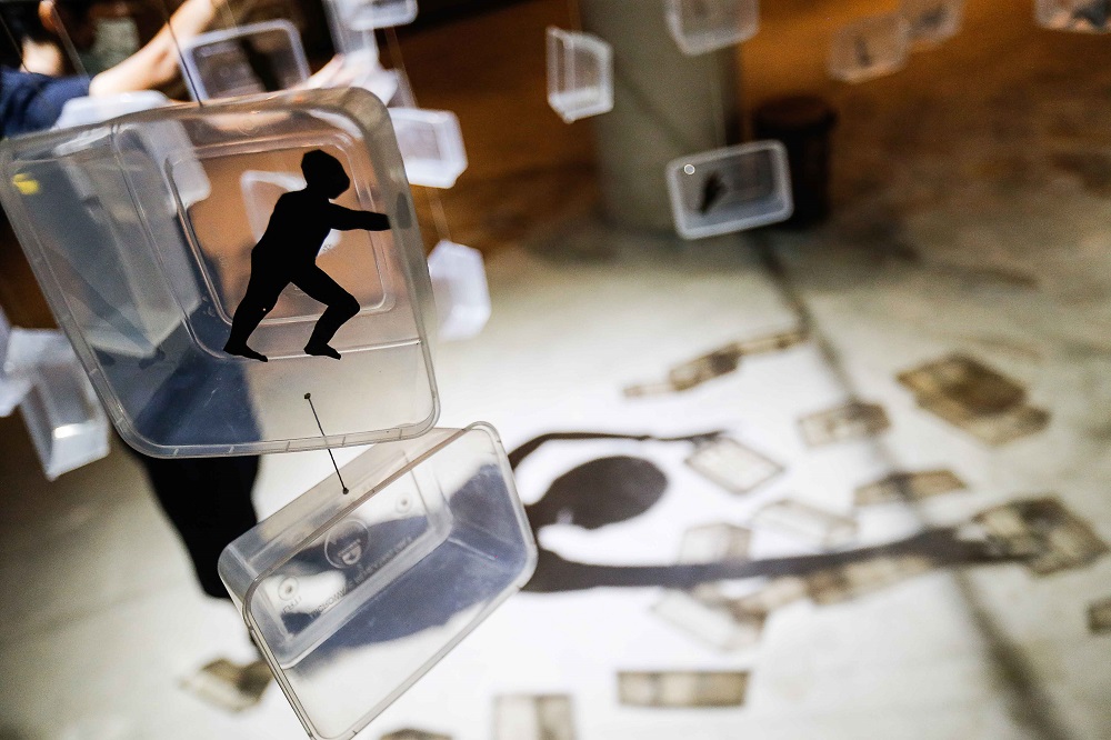 Many of the boxes contain cut-out shapes depicting us as we lived in isolation during the many lockdowns. 