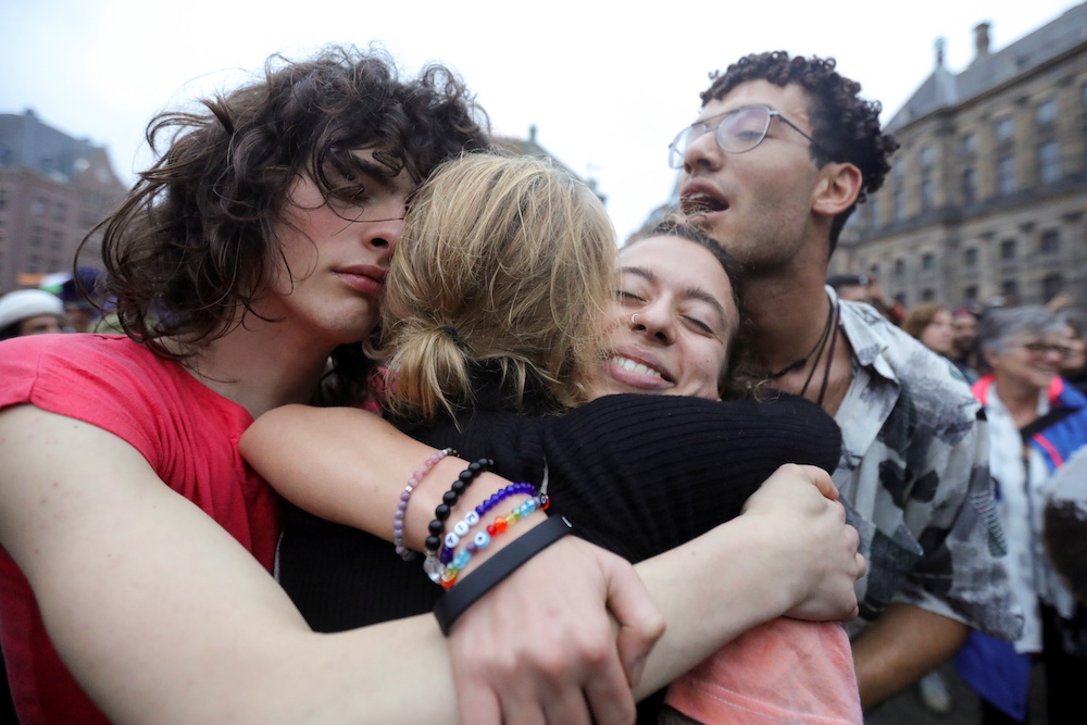 Protestors hug each other during a demonstration against coronavirus disease (Covid-19) measures in Amsterdam, Netherlands, November 20, 2021. u00e2u20acu201d Reuters pic