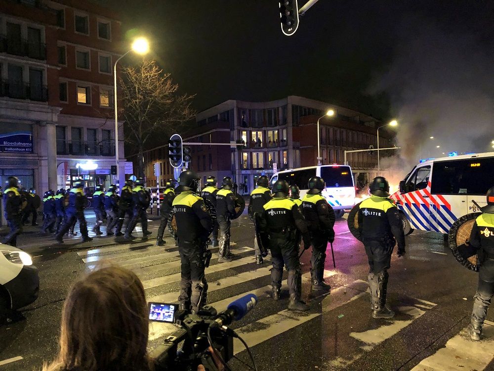 Riot police officers stand in position in a street of The Hague during a demonstration against the Dutch government's coronavirus measures, November 20, 2021. u00e2u20acu201d AFP pic
