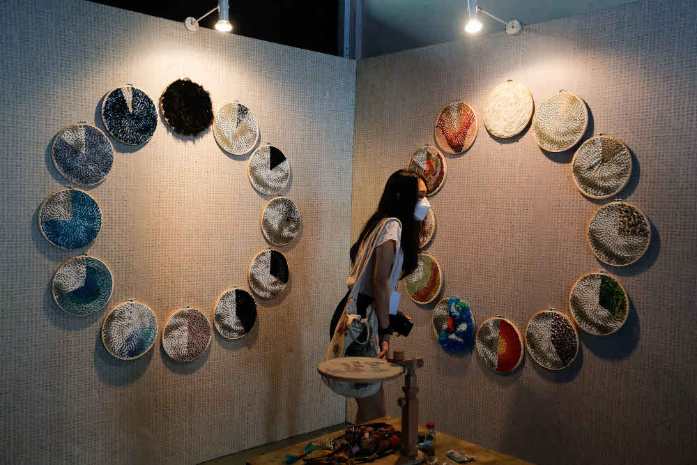 Visitors look at art installations during the 3 X 3 Group Exhibition in conjunction with the Georgetown Festival in Penang November 26, 2021. — Picture by Sayuti Zainudin