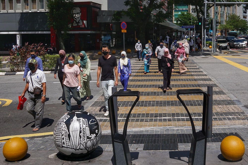 People wear face masks to curb the spread of Covid-19 pandemic in Kuala Lumpur November 29, 2021. u00e2u20acu201d Picture by Ahmad Zamzahurinn