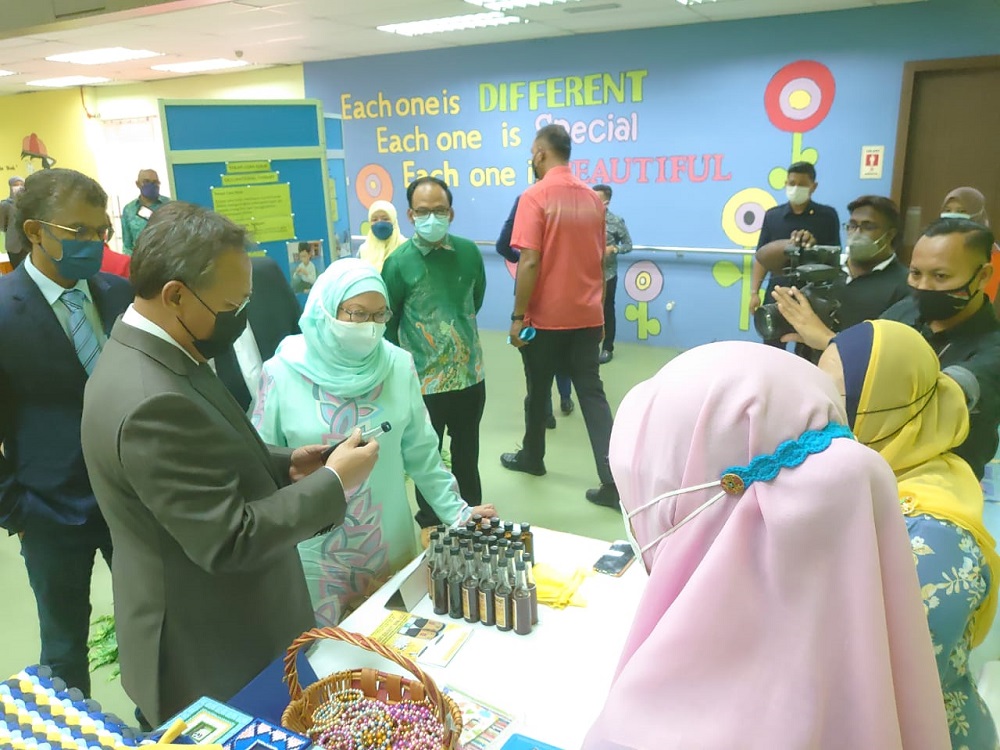 Johor Mentri Besar Datuk Hasni Mohammad (far left) during his visit to the Johor Cerebral Palsy Association in Johor Baru today. November 30, 2021. u00e2u20acu201d Picture by Ben Tan