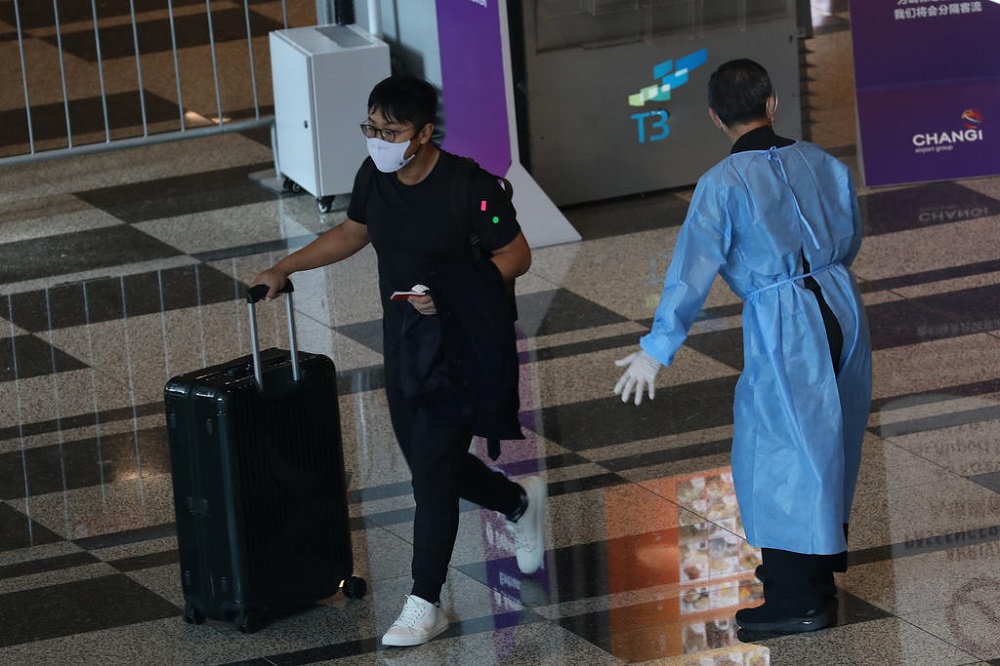A passenger arriving on a VTL flight at Changi Airport Terminal 3 in Singapore on October 19, 2021. u00e2u20acu201d TODAY pic
