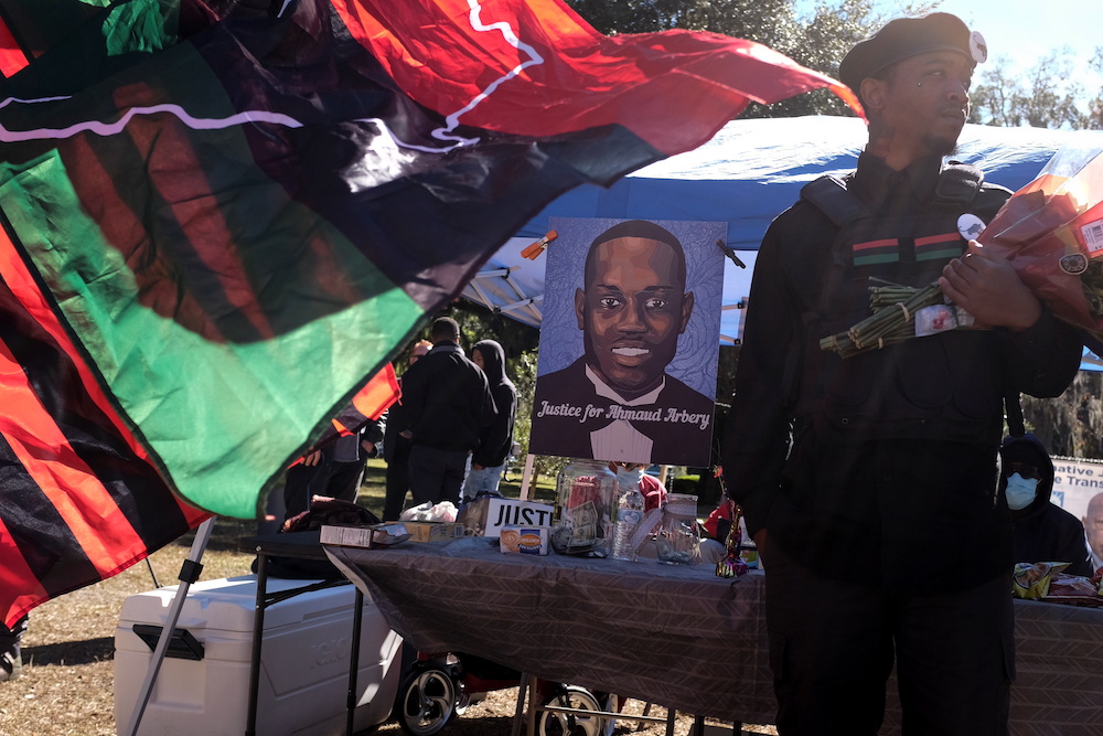 A poster depicting Ahmaud Arbery is seen outside the Glynn County Courthouse while Greg McMichael, his son Travis McMichael and William Bryan are tried over the killing of Ahmaud Arbery, in Brunswick, Georgia November 23, 2021. u00e2u20acu201d Reuters pic