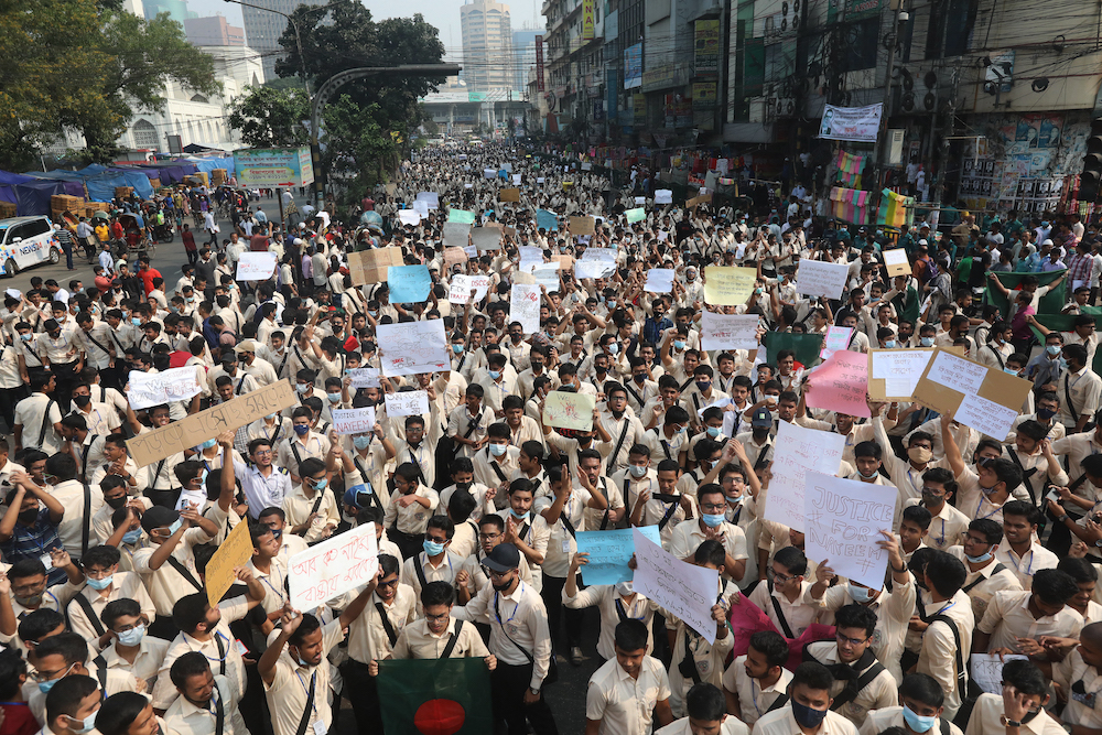 Students block a road during a protest to demand road safety in Dhaka on November 25, 2021, a day after the death of a high school student in a road accident. u00e2u20acu201d AFP pic