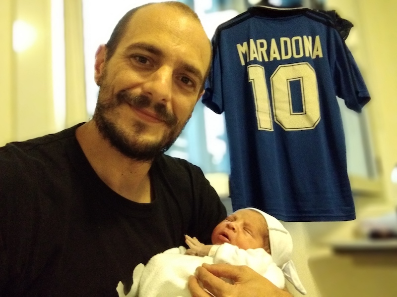In this handout photo released by Rotundo Family, Walter Rotundo poses with his newborn son Diego Amado Rotundo, in a clinic in Buenos Aires November 25, 2021. u00e2u20acu201d AFP/Rotundo Family pic