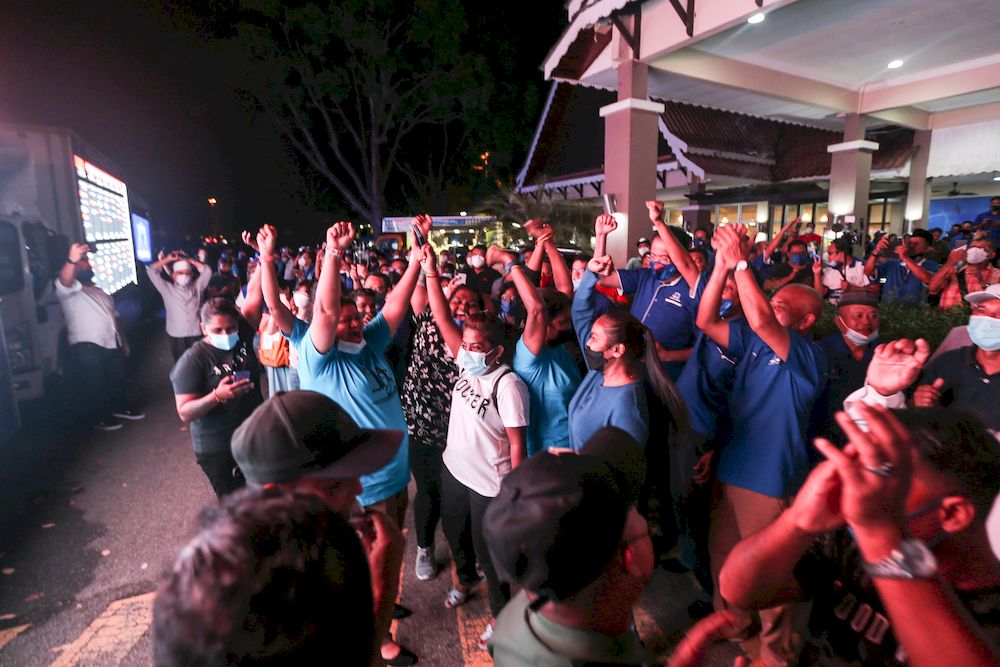 Barisan Nasional supporters celebrate a win for the coalition during the Melaka state election vote count at Dewan Seri Chendana, Ayer Keroh November 20, 2021. ― Picture by Ahmad Zamzahuri