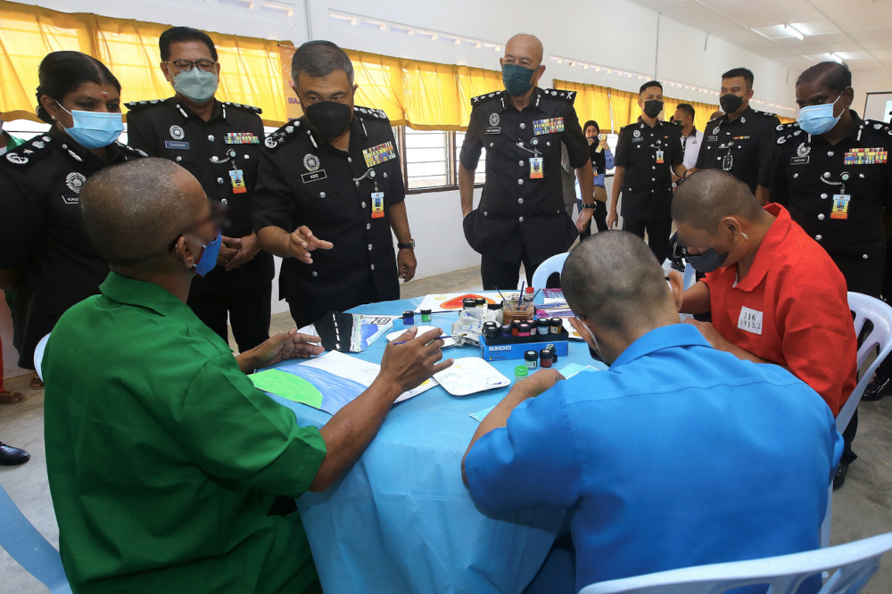 Deputy Commissioner General of Prisons (Security and Correctional) of the Malaysian Prisons Department Datuk Abdul Aziz Abd Razak (3rd left) speaks to inmates at the Jelebu Drug Rehabilitation Institution, November 16, 2021. u00e2u20acu201d Bernama pic 