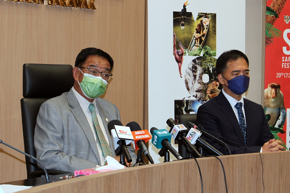Datuk Seri Abdul Karim Rahman Hamzah speaks at a press conference at Baitulmakmur Building II, Petra Jaya November 9, 2021 while Ministry of Tourism, Arts and Culture permanent secretary Hii Chang Kee looks on. u00e2u20acu201d Borneo Post Online pic 