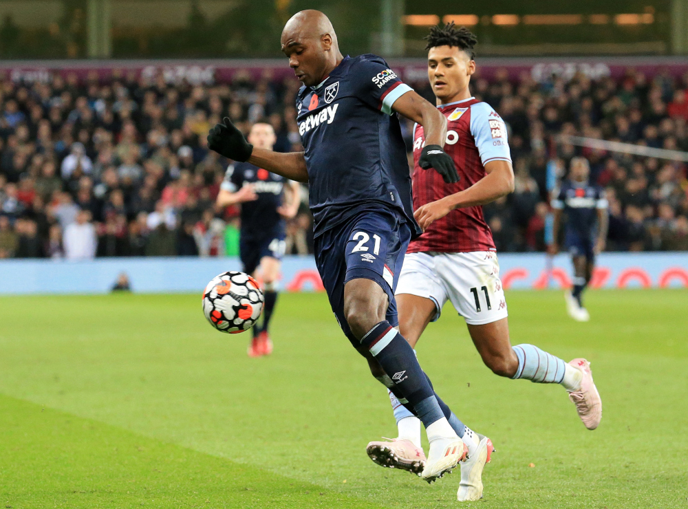 Aston Villau00e2u20acu2122s English striker Ollie Watkins vies with West Ham Unitedu00e2u20acu2122s Italian defender Angelo Ogbonna during the English Premier League match at Villa Park in Birmingham, October 31, 2021. u00e2u20acu201d AFP picnn
