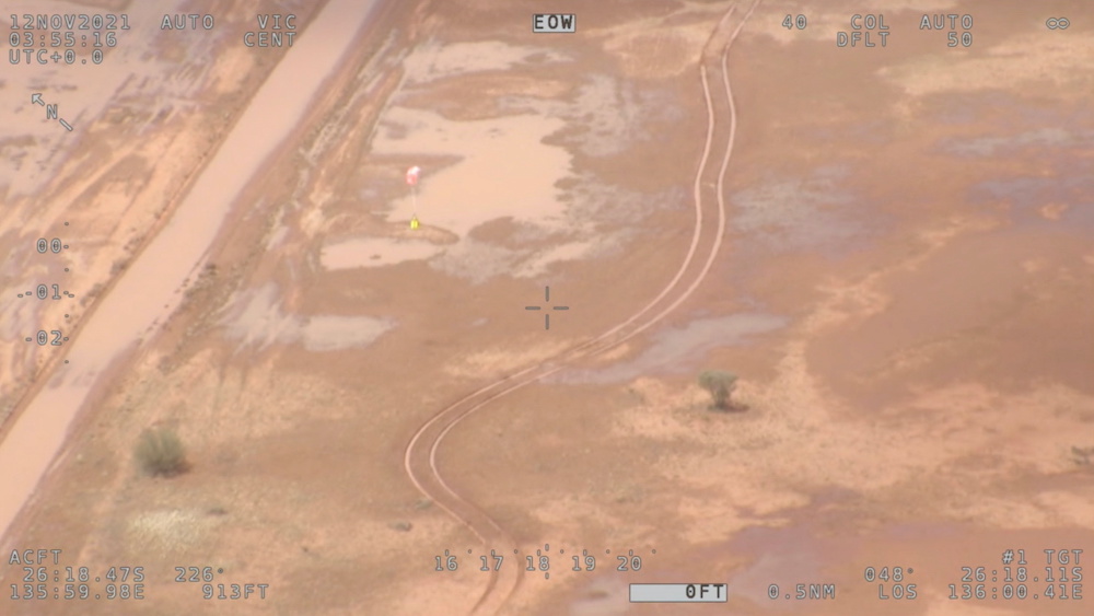 Supplies are being airdropped by authorities after torrential rain bogged a campervan, at a flooded area in the Simpson Desert, Australia November 12, 2021 in this screen grab taken from an aerial footage. u00e2u20acu2022 Reutersnn