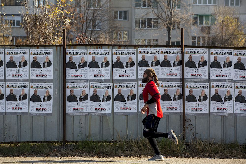 People walking in front of election posters in Sofia, Bulgaria on November 13, 2021. u00e2u20acu201d Reuters pic