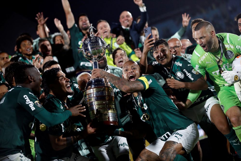 Palmeiras players celebrate winning the Copa Libertadores with the trophy at Estadio Centenario, Montevideo November 27, 2021. u00e2u20acu201d Reuters pic