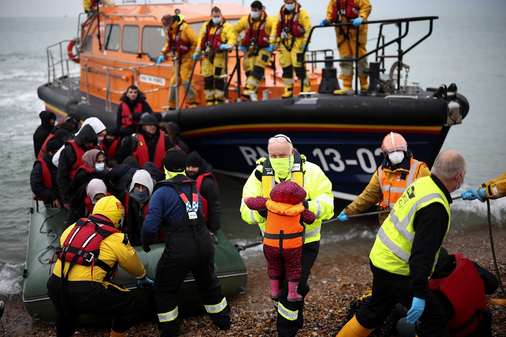 Migrants are brought ashore by RNLI Lifeboat staff, after having crossed the channel, in Dungeness, Britain, November 24, 2021. u00e2u20acu2022 Reuters pic