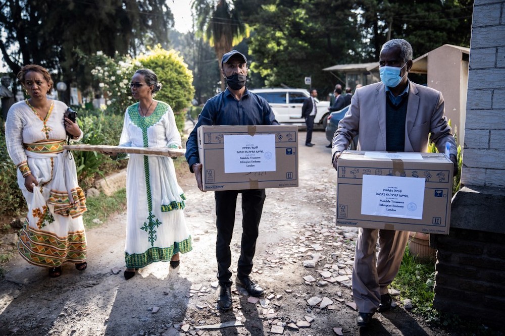 Staff carry boxes containing recovered items to be on display at the National Museum as Ethiopia hailed the return of precious artefacts looted by British soldiers more than 150 years ago in Addis Ababa, Ethiopia, on November 20, 2021, two months after th