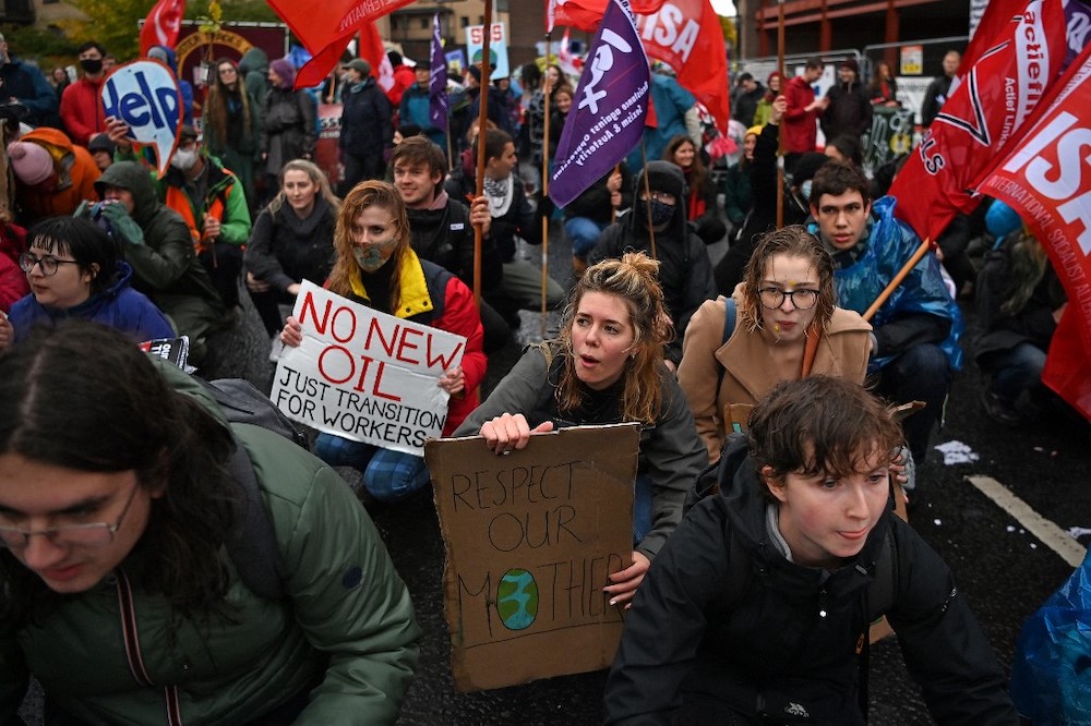 People participate in a protest rally during a global day of action on climate change in Glasgow on November 6, 2021, during the COP26 UN Climate Change Conference. u00e2u20acu201d Reuters picnn