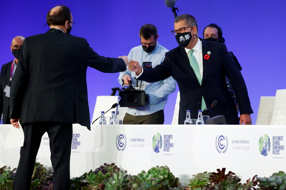 COP26 President Alok Sharma fist bumps a person during the UN Climate Change Conference (COP26) in Glasgow, Scotland, Britain November 13, 2021. u00e2u20acu2022 Reuters pic
