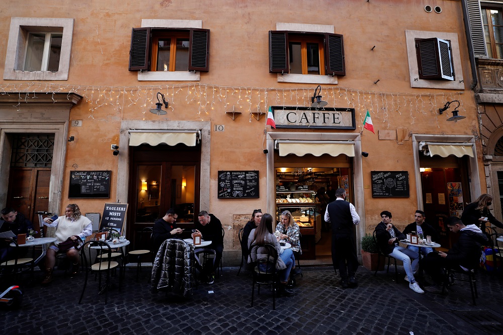 People sit at a bar in Rome, Italy November 24, 2021. u00e2u20acu2022 Reuters pic