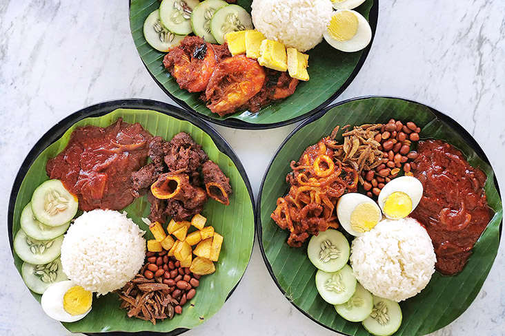 'Nasi lemak', Kadei style, with (clockwise from top) sambal prawns, 'sotong' and mutton 'varuval.'