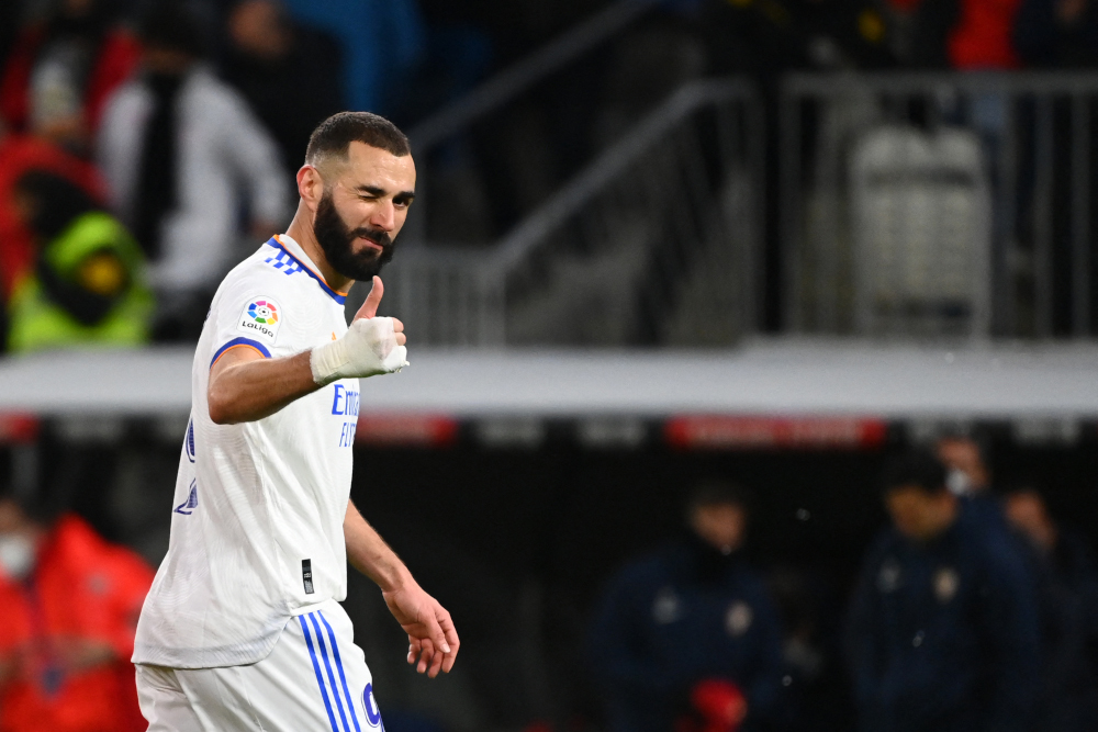 Real Madrid forward Karim Benzema gives a thumbs-up during the Spanish league football match between Real Madrid CF and Sevilla FC at the Santiago Bernabeu stadium in Madrid, November 28, 2021. u00e2u20acu201d AFP pic 