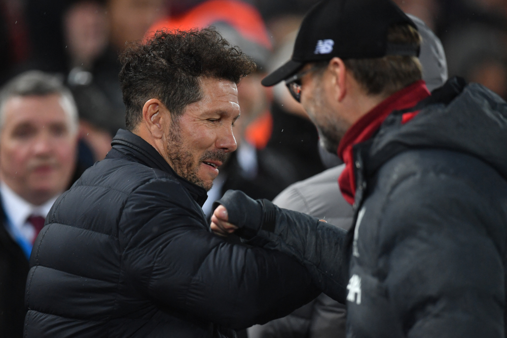 Atletico Madrid coach Diego Simeone and Liverpool manager Jurgen Klopp gesture during the Uefa Champions league Round of 16 second leg football at Anfield in Liverpool, March 11, 2020. u00e2u20acu201d AFP pic 