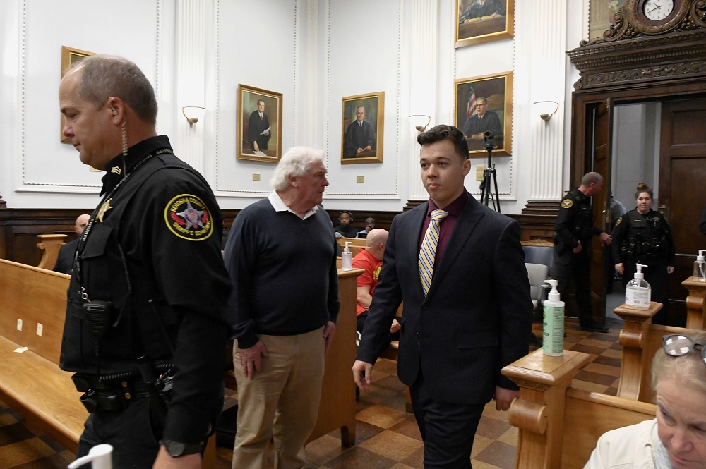 Kyle Rittenhouse is led by Kenosha County Sheriff Bill Beth as he re-enters the courtroom after the morning break during his trial at the Kenosha County Courthouse in Kenosha, Wisconsin November 11, 2021. ― Reuters pic