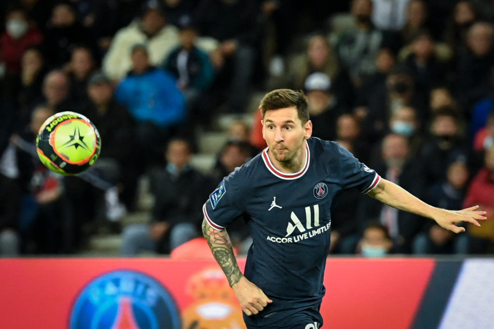 Paris Saint-Germain forward Lionel Messi eyes the ball during the French L1 match against LOSC Lille at the Parc des Princes stadium, in Paris, October 29, 2021. u00e2u20acu201d AFP pic 