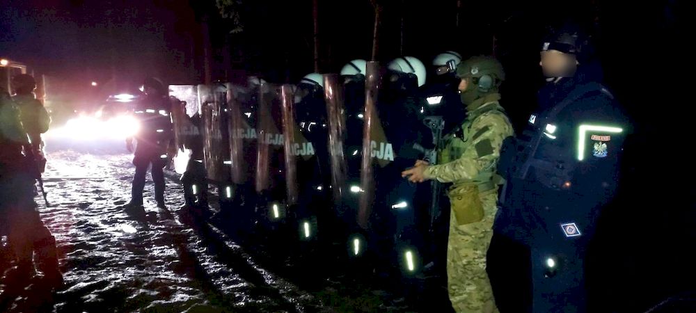 Polish law enforcement officers stand guard near the Polish-Belarusian border outside the settlement of Starzyna, Poland, in this image released by the Polish Police November 24, 2021. u00e2u20acu201d Policja Podlaska/ Reuters pic