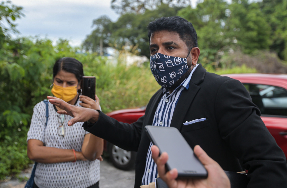 M. Indira Gandhi with Indira Gandhi Action Team (Ingat) chairman Arun Dorasamy speaking to the press at the Ipoh police district headquarters, November 18, 2021. u00e2u20acu201d Picture by Farhan Najib