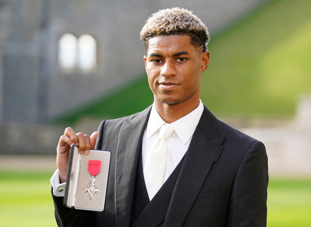 Marcus Rashford with his medal after being appointed a Member of the Order of the British Empire following an investiture ceremony at Windsor Castle in Windsor, west of London, November 9, 2021. u00e2u20acu201d AFP pic 