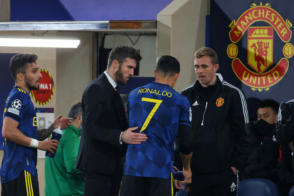 Manchester United coach Michael Carrick talks to forward Cristiano Ronaldo during the Uefa Champions League Group F football match between Villarreal CF and Manchester United, at La Ceramica stadium in Vila-real, November 23, 2021. u00e2u20acu201d AFP pic 