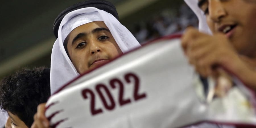In this file photo taken on September 10, 2019 a Qatari football fan cheers for his team with a scarf showing the number 2022 for the upcoming FIFA World Cup. u00e2u20acu2022 ETX Studio picnnn