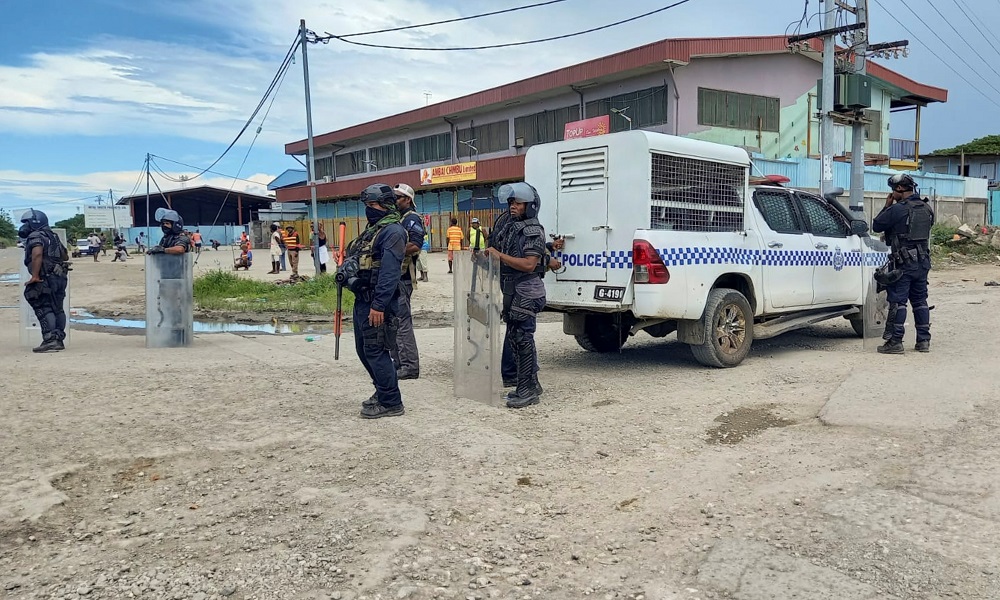 Royal Solomon Islands Police Force officers stand at a checkpoint after days of unrest in Honiara, Solomon Islands November 26, 2021. u00e2u20acu2022 Reuters pic
