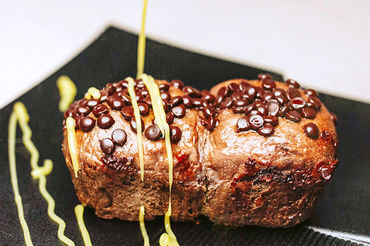 One of Loffi’s bestselling sourdough pillow buns is their Belgian Dark Chocolate, drizzled with a lemon glaze.