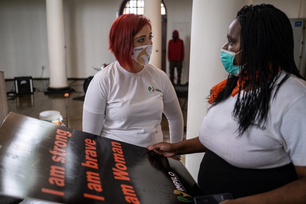 Travellers queue at a check-in counter at OR Tambo International Airport in Johannesburg on November 27, 2021, after several countries banned flights from South Africa following the discovery of a new Covid-19 variant Omicron. — AFP pic