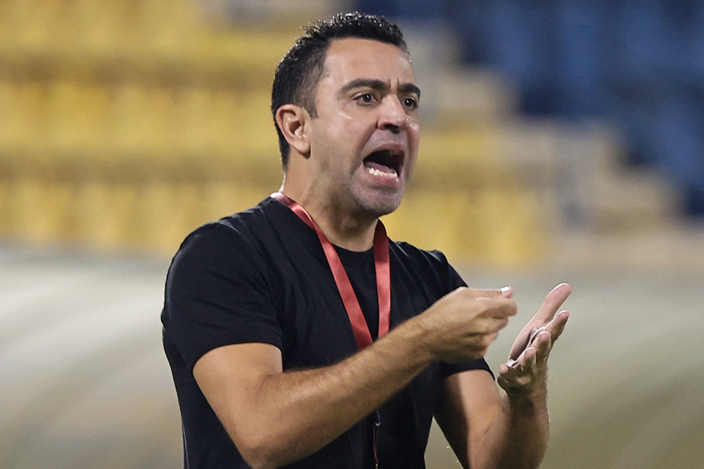 Qatari football club Al-Sadd SCu00e2u20acu2122s coach Xavi Hernandez reacts during Qatar Stars League match between al-Sadd SC and al-Duhail SC, at Thani Bin Jassim Stadium (Al-Gharafah Stadium) in Doha, November 3, 2021. u00e2u20acu201d AFP picn