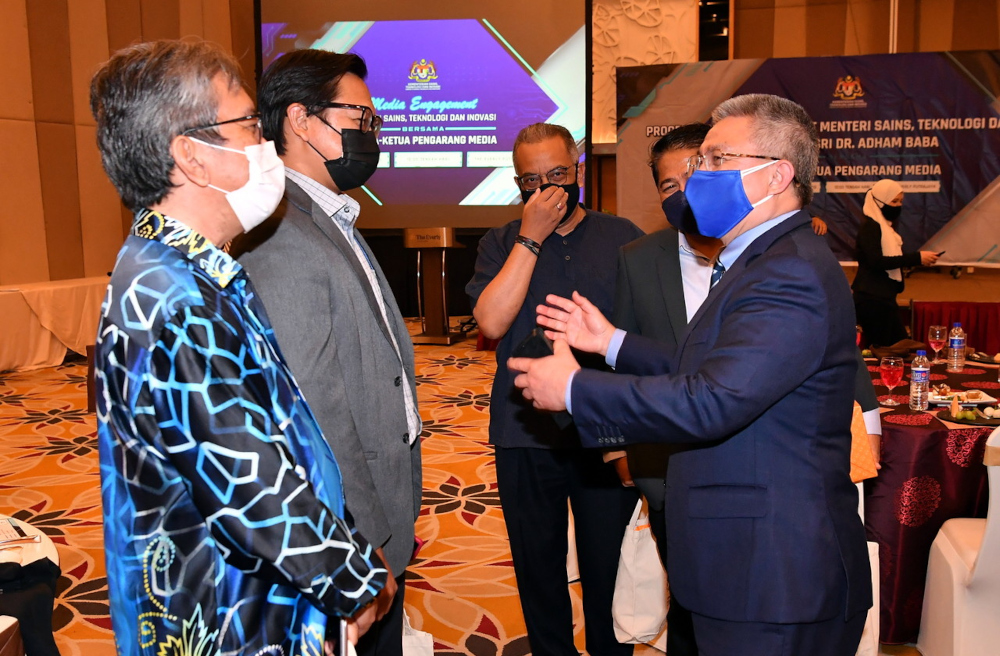 Science, Technology and Innovation (Mosti) minister Datuk Seri Dr Adham Baba with Bernama editor-in-chief Abdul Rahman Ahmad during a media engagement programme in Putrajaya, November 25, 2021. u00e2u20acu201d Bernama pic 